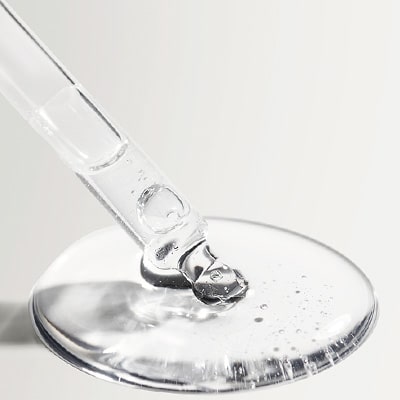 clear liquid with glass dropper