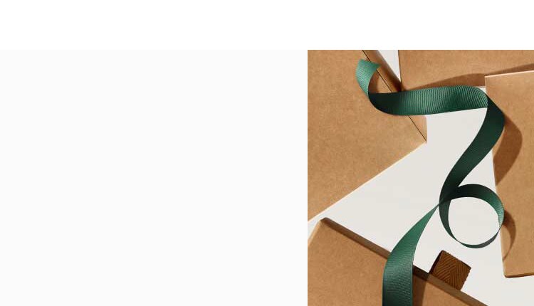 white background with brown gift boxes and dark green ribbon 